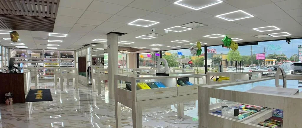 Bright retail interior with custom display tables and glass showcases